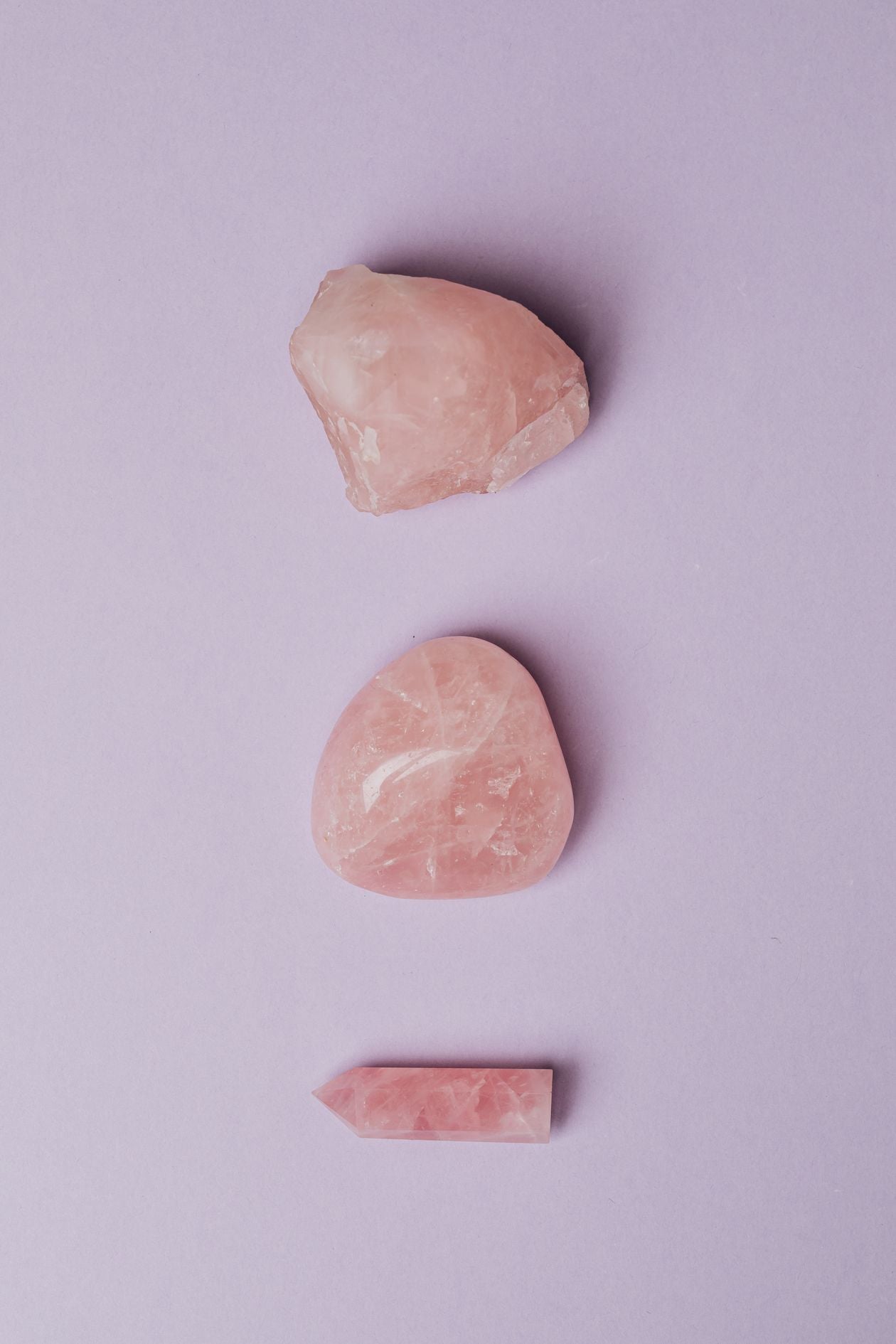 Rose Quartz crystal pieces — raw, tumbled and point forms