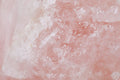 Rose Quartz raw crystal close-up — natural pink texture of the love frequency stone